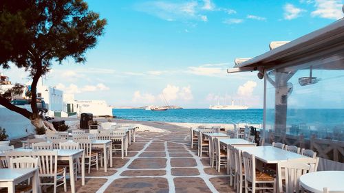 View of swimming pool by sea against sky