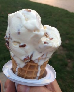 Close-up of hand holding ice cream