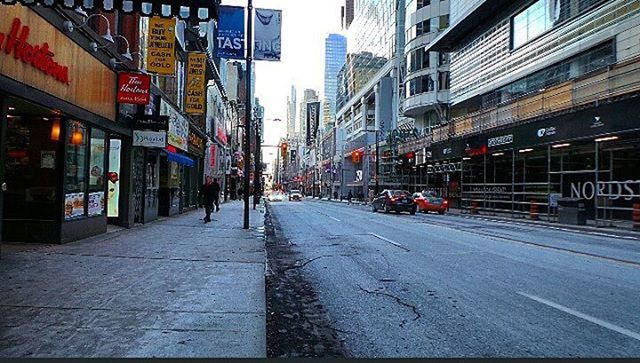 building exterior, architecture, built structure, city, street, transportation, city life, building, the way forward, city street, road, car, incidental people, road marking, residential building, diminishing perspective, residential structure, outdoors, sidewalk, land vehicle