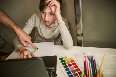 Portrait of young woman working at home