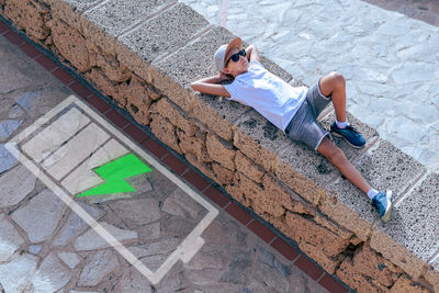 High angle view of woman standing on railroad track