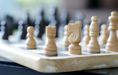 Close-up of chess pieces on board