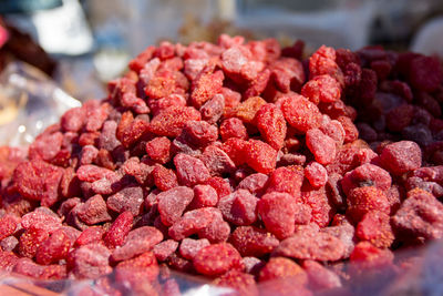 Close-up of dried strawberries for sale at market stall