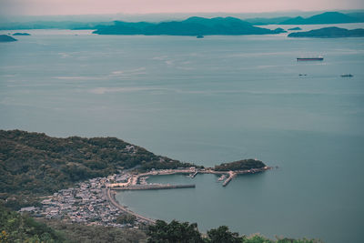 High angle view of boats in sea against sky