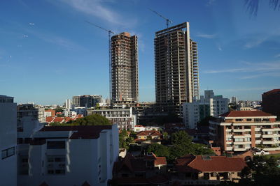 Buildings in city against sky