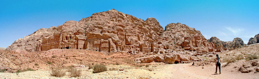 Low angle view of rock formation against clear blue sky