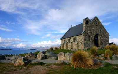 Church of the good shepherd by lake tekapo against sky