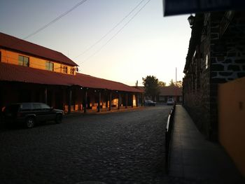 Street in city against clear sky