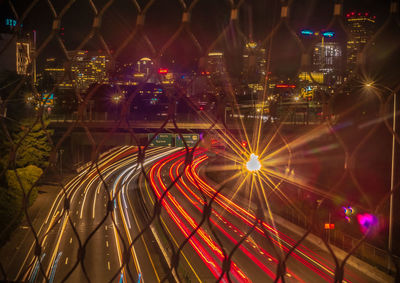 High angle view of light trails on road at night