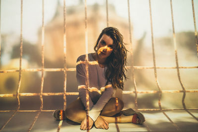 Portrait of woman sitting outdoors