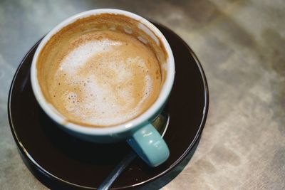 High angle view of cappuccino on table