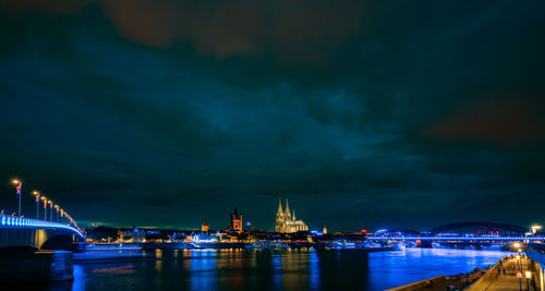 Illuminated city at waterfront