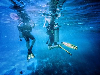 People swimming in sea