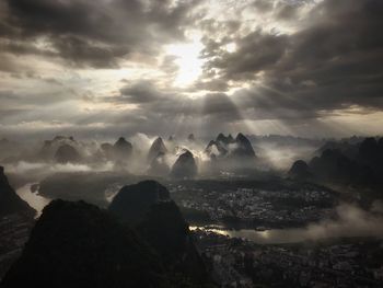 Scenic view of rocks against sky during sunset