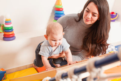 Mother and son with toys