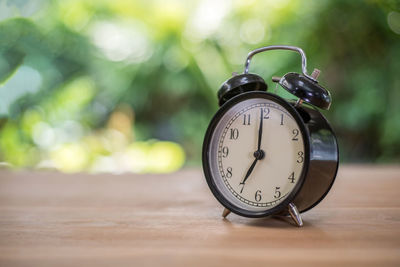 Close-up of clock on table