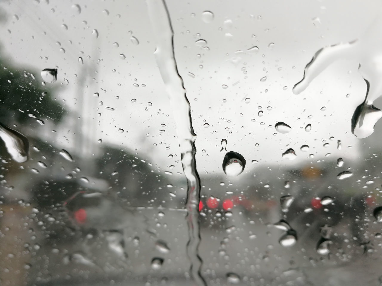 RAINDROPS ON GLASS WINDOW