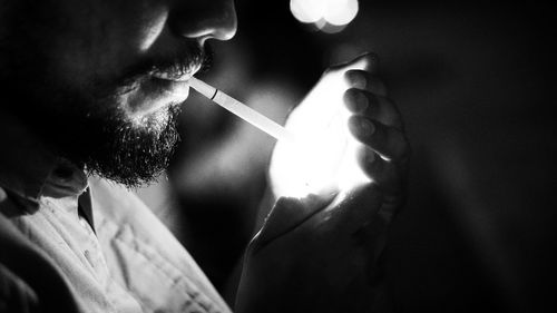 Close-up of man smoking cigarette