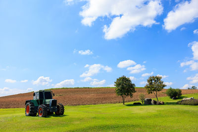 Scenic view of agricultural field against sky