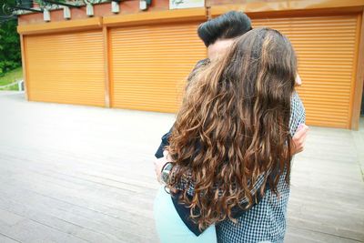 Couple embracing on street