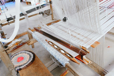 High angle view of loom at textile industry