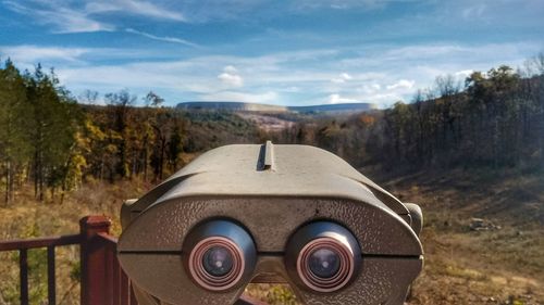 Binoculars against mountains