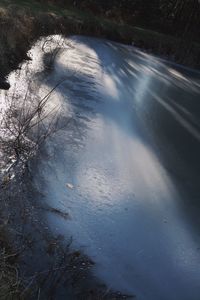 High angle view of frozen water on land