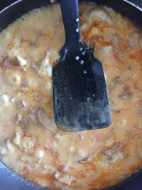 Close-up of meat in cooking pan