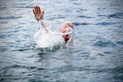 Man swimming in sea