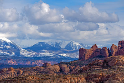 Scenic view of mountains against cloudy sky