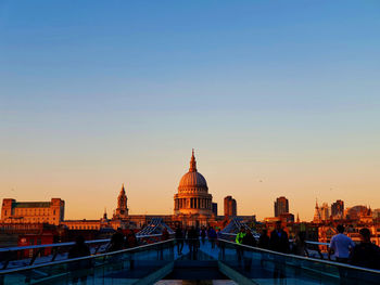 View of buildings in city against clear sky