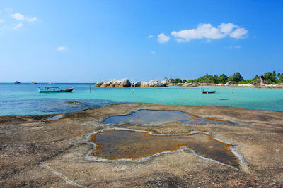 Scenic view of belitung island beach against sky