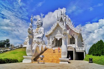 Low angle view of statue against cloudy sky