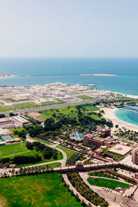 High angle view of swimming pool by sea against sky