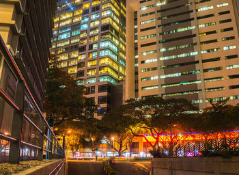 Low angle view of illuminated buildings in city