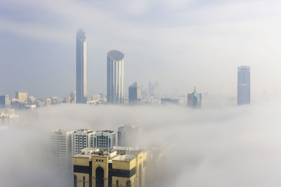 Buildings in city against sky