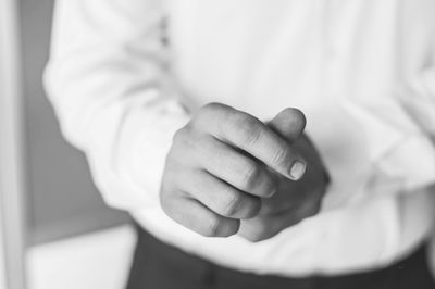 Midsection of man standing indoors