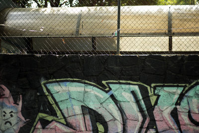 Graffiti on chainlink fence