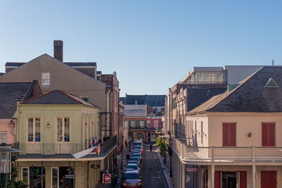 Buildings in city against clear sky