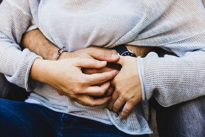 Close-up of man holding hands