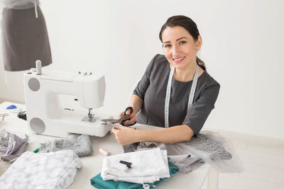 Portrait of a smiling young woman working