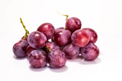 Close-up of fruits over white background