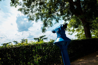 Low angle view of statue against trees