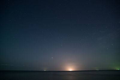 Scenic view of sea against sky at night