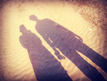 Shadow of people on wall