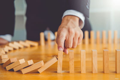 Close-up of hands on table