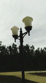 Low angle view of street light against sky