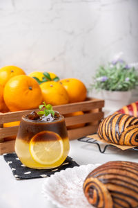 Close-up of orange juice on table