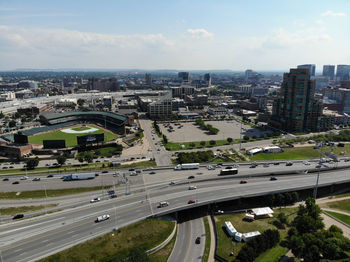 High angle view of street and cityscape against sky