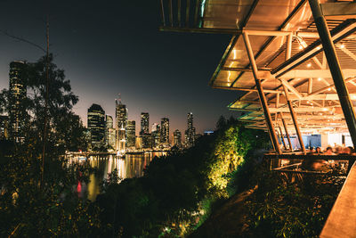 Low angle view of buildings in city at night